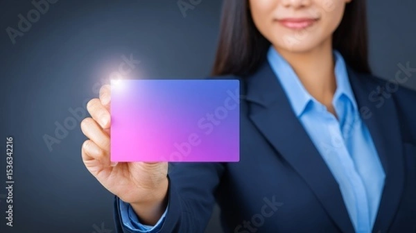 Fototapeta Professional woman displaying a vibrant blank card for branding or networking.