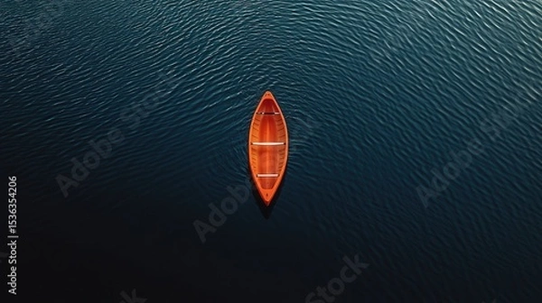 Obraz Tiny Bright Orange Canoe Drifting on a Deep, Shadowy Lake 
