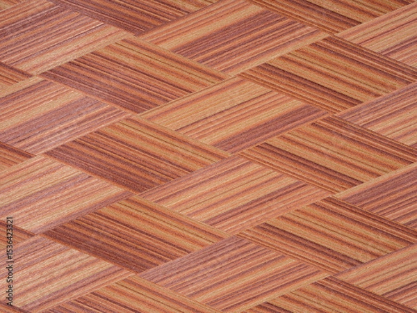 Fototapeta Interwoven mahogany strips reveal a rich tapestry of burnt sienna and copper, artfully aligned in a herringbone allure