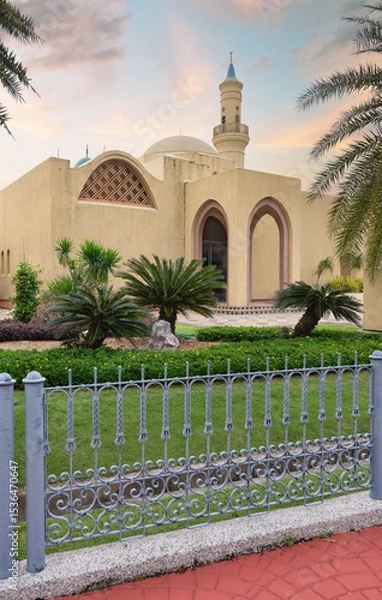Fototapeta Ash Shaliheen Mosque, with its remarkable architecture and picturesque surroundings in Bandar Seri Begawan, Brunei Darussalam, stands out against the backdrop of a sunset sky, framed by balustrade