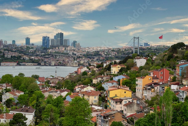 Fototapeta Istanbul, Turkey, with its skyline featuring the Bosphorus Strait, towering buildings on the European side, and the iconic Bosphorus Bridge