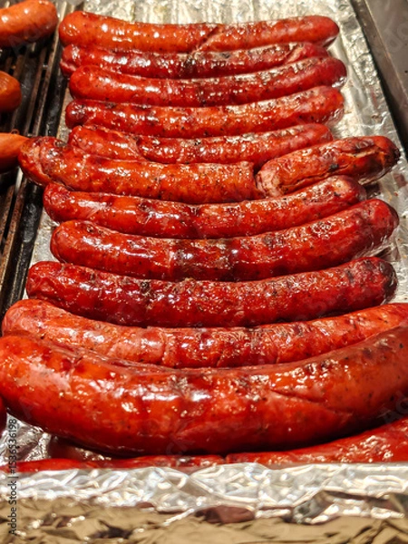 Obraz Large assortment of grilled sausages and kebabs at  Cracow christmas market