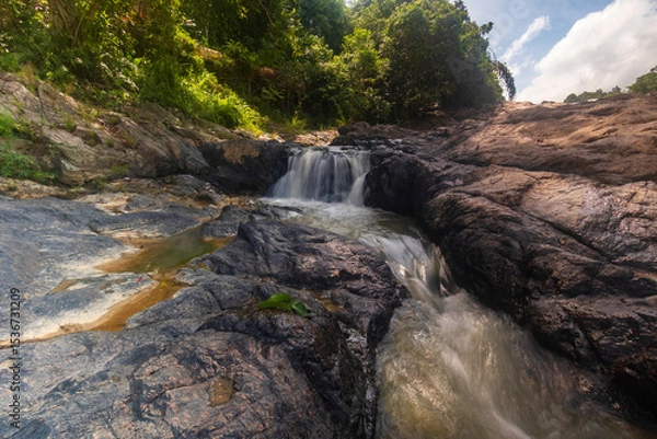 Obraz waterfall cascades over the rocks