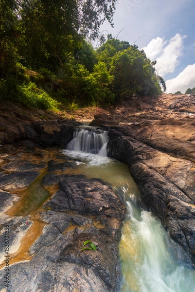Obraz waterfall cascades over the rocks