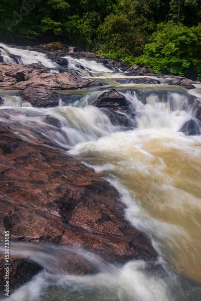 Obraz waterfall cascades over the rocks