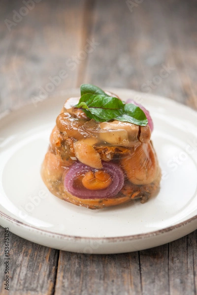 Fototapeta Terrine with milk cap mushrooms and red onion 