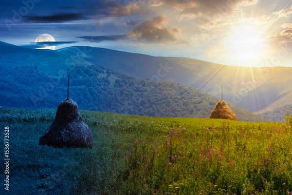 Fototapeta rural mountain landscape on summer solstice. day and night time change concept. haystack on green hill. alpine scenery at the foot ridge with sun and moon at twilight
