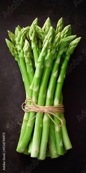 Obraz Fresh green asparagus bunch on dark rustic background