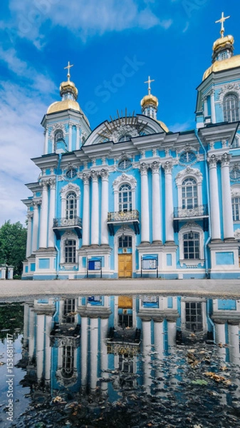 Obraz Panoramic view of St. Nicholas Naval Cathedral with beautiful reflection in water. Nikolo-Bogoyavlenskiy Morskoy Sobor built in 1762 in Saint Petersburg, Russia