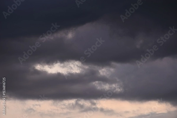 Obraz dark rain cloud floating on sky at sunset in evening