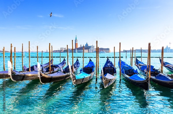 Fototapeta Gondolas on the Grand canal in Venice, Italy. In background, on island of San Giorgio, is the Church of San Giorgio Maggiore with bell tower.