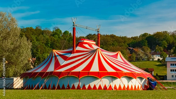 Obraz Spring landscape with a red and white circus tent on a sunny day at Postmuenster, Rottal Inn, Bavaria, Germany