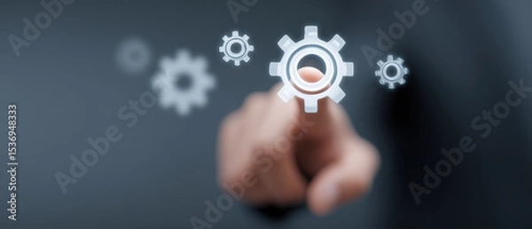 Fototapeta Hand interacts with floating digital gears, symbolizing technology and innovation