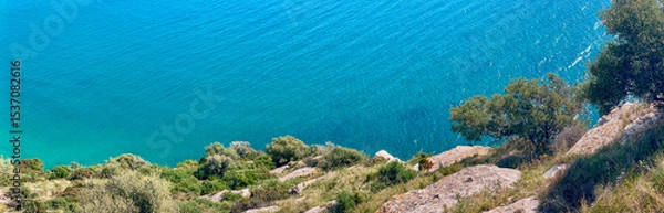 Fototapeta view from high cliffs on a beautiful turquoise blue sea in Puglia in italy