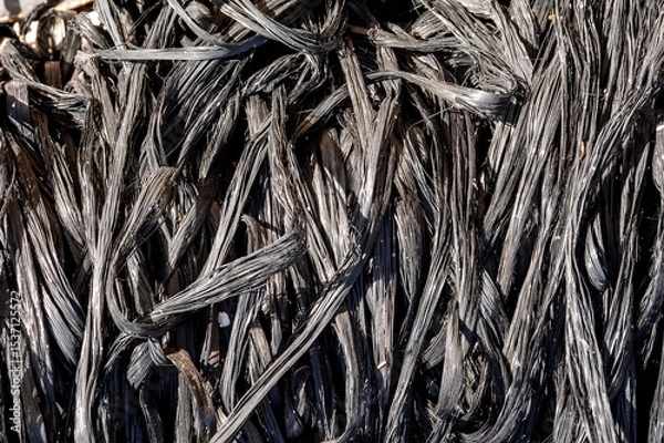 Fototapeta Close-up of melted plastic fibers – Abstract lines and patterns from burned material in black and gray color