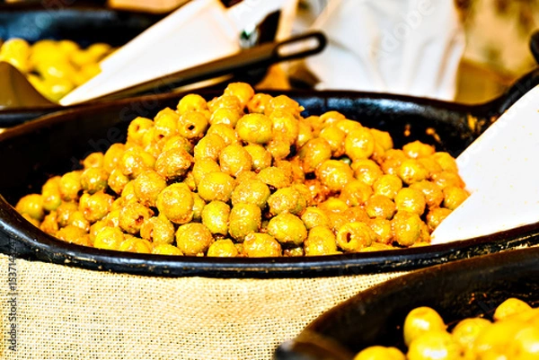 Obraz Container with fresh and delicious green olives	
