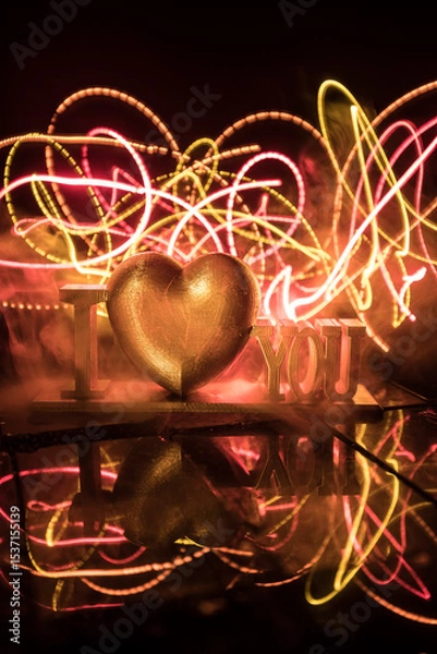 Fototapeta A Miniature Table Scene with Items Symbolizing Love, Relationships, and Romance, Including a Heartfelt Love Card, Perfectly Capturing the Spirit of Valentine's Day.