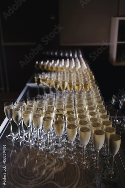 Fototapeta Rows of Champagne Glasses on Display Table