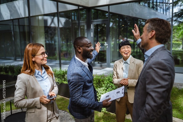 Obraz black businessman hold clipboard explain details to diverse colleagues
