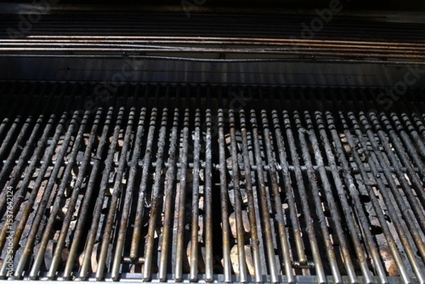 Obraz dirty grill bars with charred debris