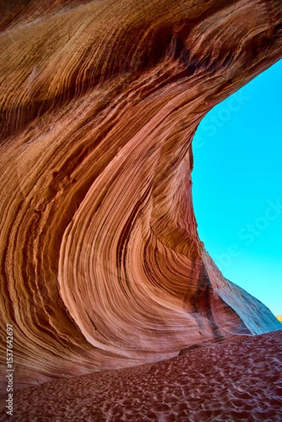 Fototapeta Sandstone Wave Motion and Canyon Walls with Sandy Floor Low Angle Perspective