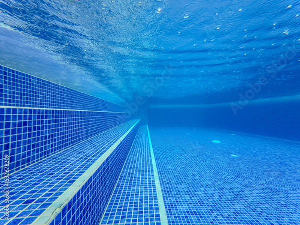 Fototapeta Underwater view of the pool mosaic tile and water jets