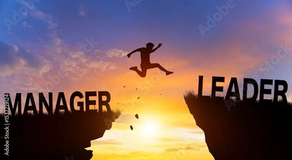 Fototapeta Silhouette man jumping from MANAGER to LEADER wording on cliffs with cloud sky and sunrise. Go ahead and Keep go on to success Concept.