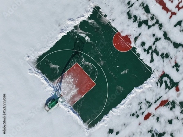Obraz The school's basketball court in winter, the basketball court is covered with snow