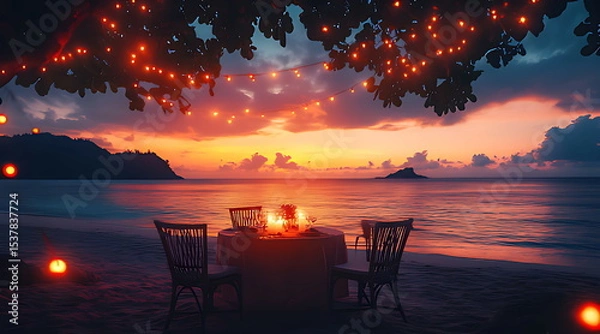 Obraz A romantic dinner setup on the beach at sunset