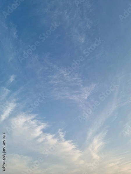 Fototapeta It's a sunset sky with fluffy clouds.