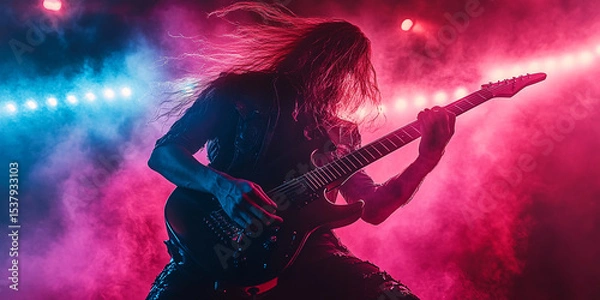Fototapeta A long-haired guitarist shreds on stage during a vibrant rock concert.