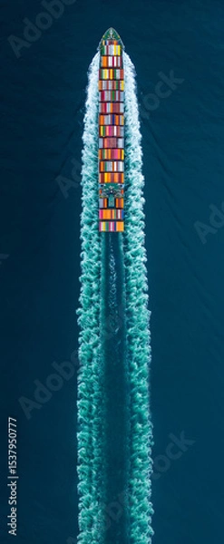 Obraz Cargo Container Ship sailing through deep blue ocean waters, leaving a vibrant symmetrical wake behind. Express Container ship running very fast.