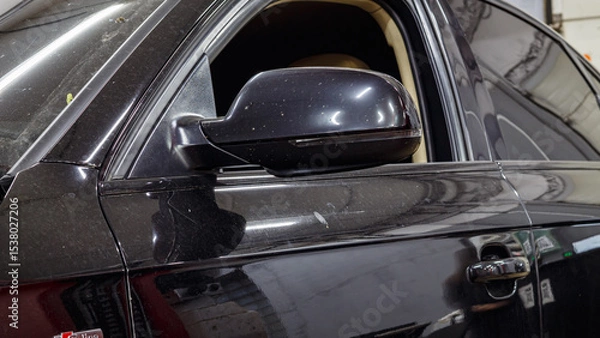 Obraz Black passenger car at the service station.