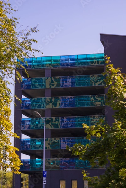 Obraz Cityscape on a summer day, modern buildings and houses against the blue sky 