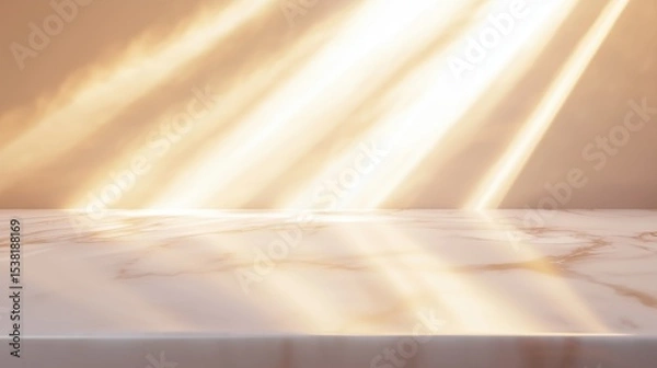 Fototapeta The image features a smooth marble surface with delicate veining, bathed in soft, golden sunlight streaming in from the top right. The background is a warm beige gradient with glowing light rays.