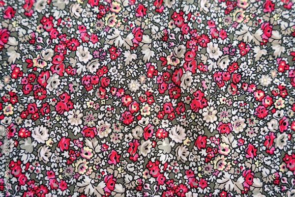 Obraz Red pink and white floral pattern on a green fabric texture background bg flowers