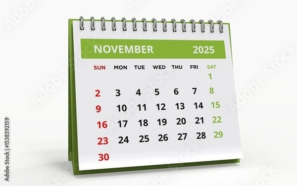 Fototapeta Standing Desk Calendar November 2025. Business monthly calendar with metal spiral-bound, the week starts on Sunday. 