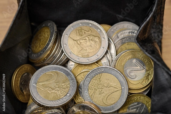 Obraz A purse with euro and Polish zloty coins