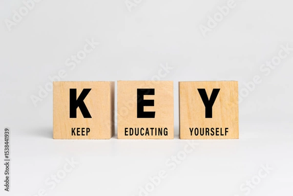 Fototapeta key acronym with keep educating yourself words text isolated on white background
