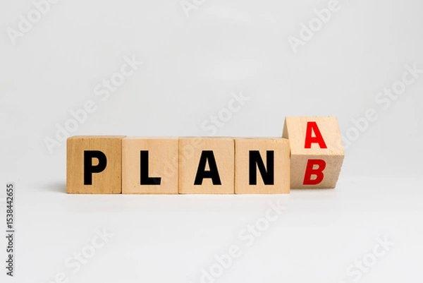 Fototapeta flip wooden blocks with plan a or b isolated on white background. concept of business strategy planning