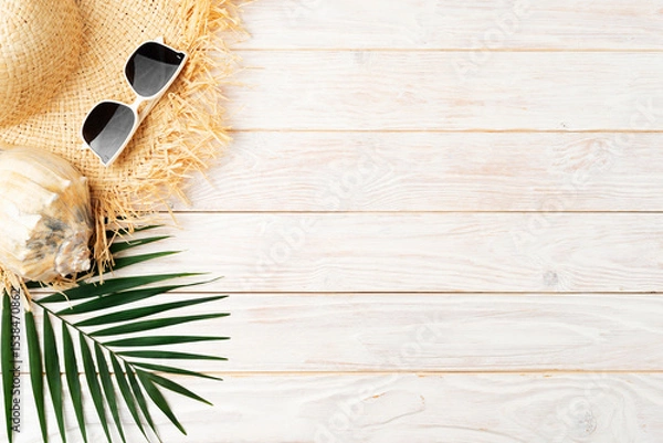 Obraz Vacation travel planning simple background of straw hat sunglasses palm leaves and shell on white planks flat lay with copy-space