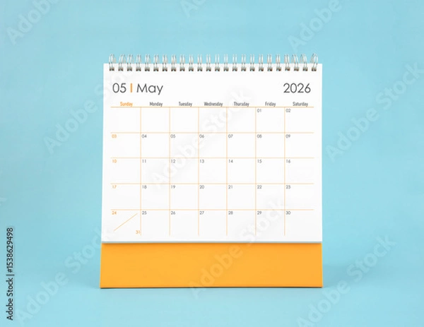 Fototapeta May 2026 white desk calendar on blue color background. Planning and goals concepts.
