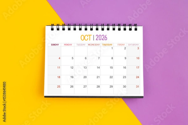Fototapeta October 2026 Monthly desk calendar for 2026 year on yellow and purple color background.