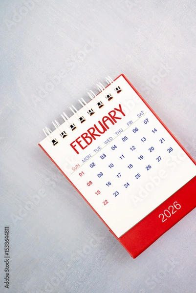Fototapeta February 2026 on gray color wooden table, Flat lay.
