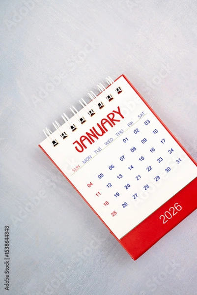 Fototapeta January 2026 on gray color wooden table, Flat lay.