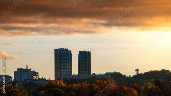 Obraz Silhouette of constructing buildings against amazing sunset red sky.