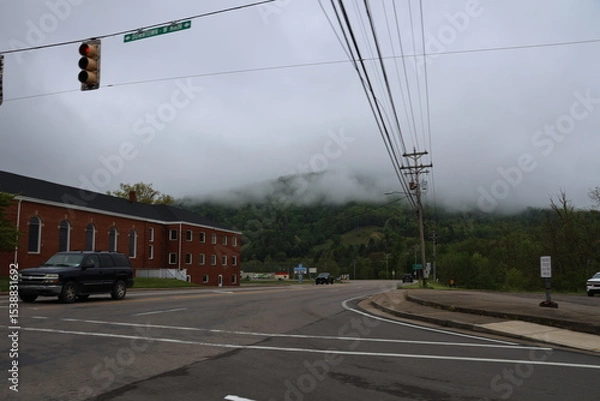 Fototapeta Rural scenery from the highway on a cloudy day.
