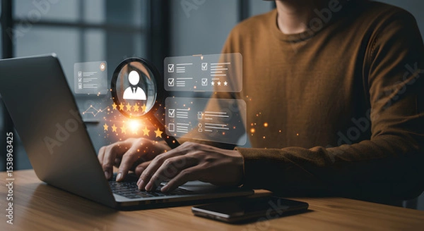 Fototapeta Person using laptop, with glowing digital overlays showing a magnifying glass over a profile icon and check lists, signifying online reputation management and review monitoring for business.