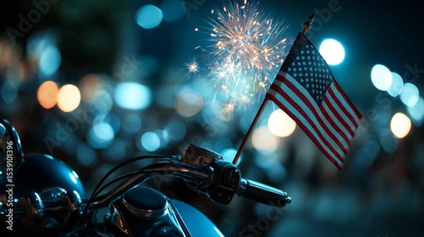 Obraz American flag on a motorcycle's antenna, with fireworks glowing in the distance.