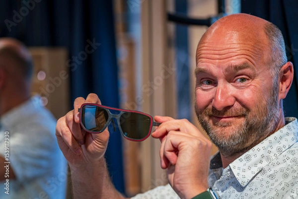 Obraz Happy man with bald head and sun glasses at shop 